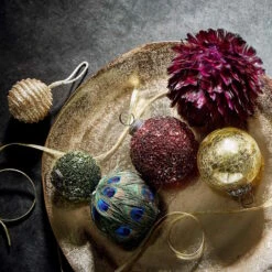 Einrichtungsgeschäft -Einrichtungsgeschäft butlers deko teller organisch o32cm banquet in bronze 1